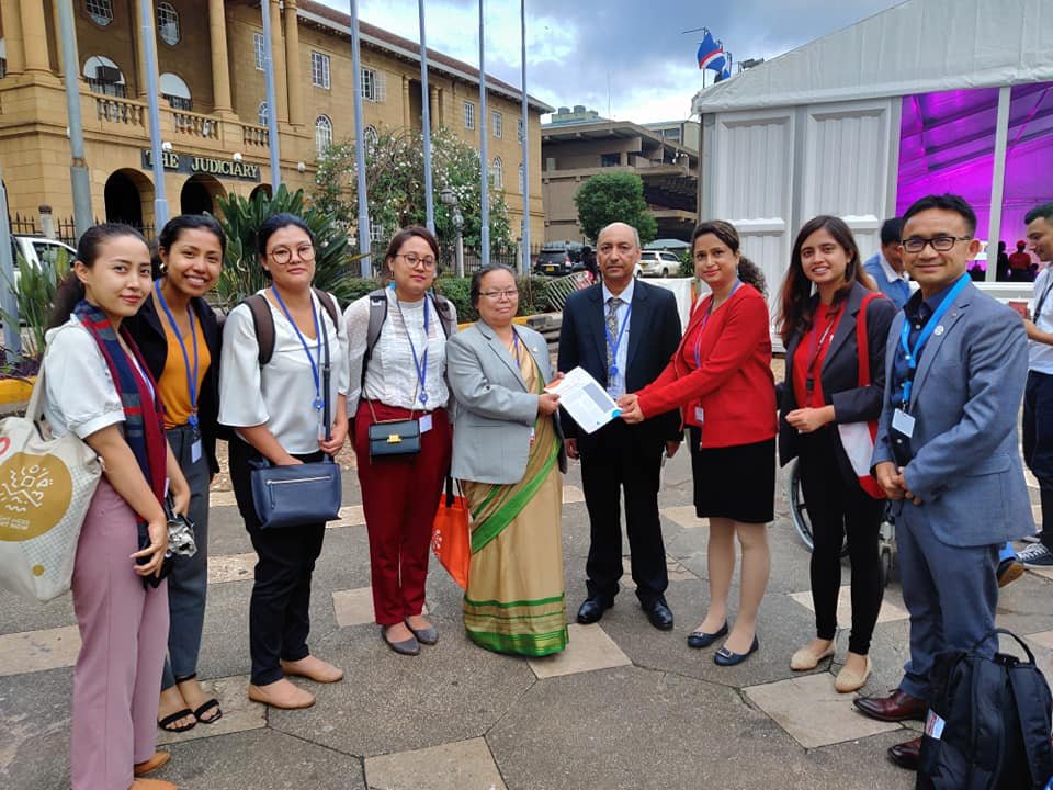 Youth delegates handing over youth recommendations for national commitment at Nairobi Summit. Photo Credit: Visible Impact